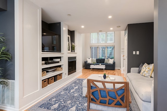 210 Des Plaines Ave Unit B, Forest Park, IL 60130 - living room with wood finished floors, recessed lighting, and baseboards