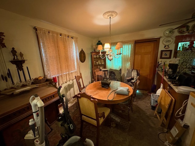 35694 N Helendale Rd, Ingleside, IL 60041 - carpeted dining room with a chandelier