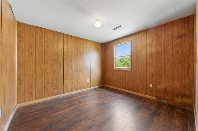 9620 S Sangamon St, Chicago, IL 60643 - empty room featuring wood finished floors, wooden walls, and baseboards