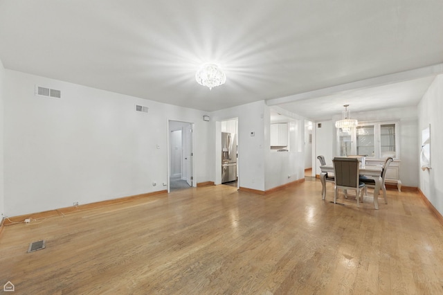 9620 S Sangamon St, Chicago, IL 60643 - living room with a chandelier, light wood-type flooring, and baseboards