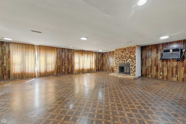 9620 S Sangamon St, Chicago, IL 60643 - unfurnished living room featuring wooden walls, a wall mounted air conditioner, a fireplace, and recessed lighting