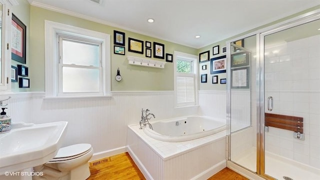 5247 Greenwood St, Skokie, IL 60077 - full bathroom with a tub with jets, a wainscoted wall, a stall shower, crown molding, and toilet