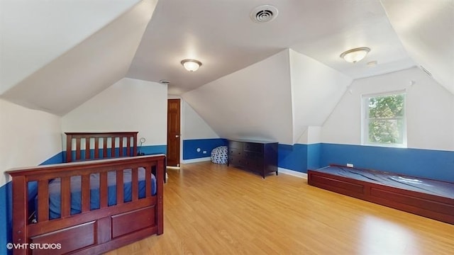5247 Greenwood St, Skokie, IL 60077 - bedroom with wood finished floors, vaulted ceiling, and baseboards