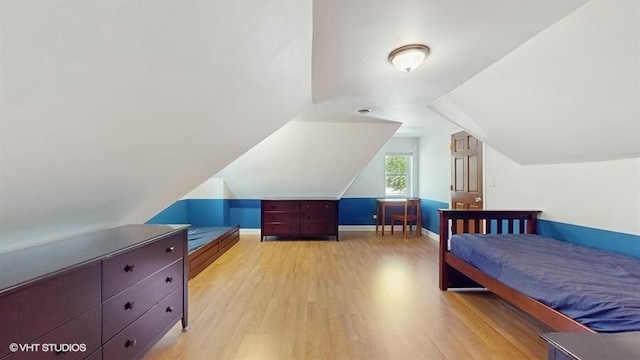5247 Greenwood St, Skokie, IL 60077 - bedroom with light wood-type flooring, baseboards, and lofted ceiling