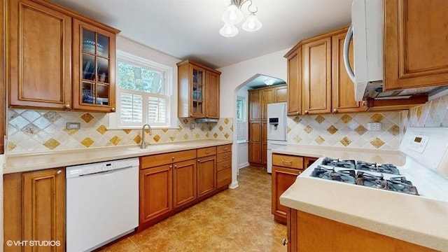 5247 Greenwood St, Skokie, IL 60077 - kitchen featuring white appliances, a sink, brown cabinets, and light countertops