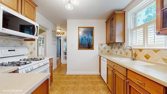 5247 Greenwood St, Skokie, IL 60077 - kitchen featuring white appliances, brown cabinets, tasteful backsplash, and light countertops