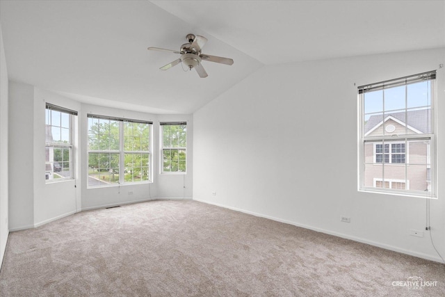 1632 Victoria Park Cir, Aurora, IL 60504 - carpeted spare room with a ceiling fan, lofted ceiling, healthy amount of natural light, and baseboards
