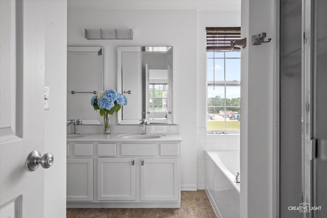1632 Victoria Park Cir, Aurora, IL 60504 - bathroom with double vanity, a garden tub, baseboards, and tile patterned floors