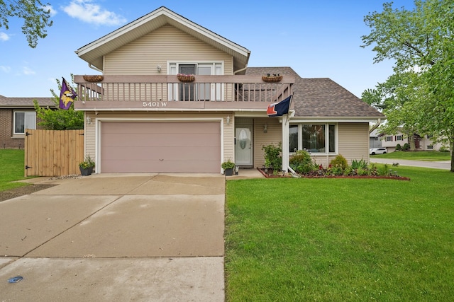 5401 W Arlington Dr, Hanover Park, IL 60133 - traditional-style house with a balcony, concrete driveway, a garage, and roof with shingles