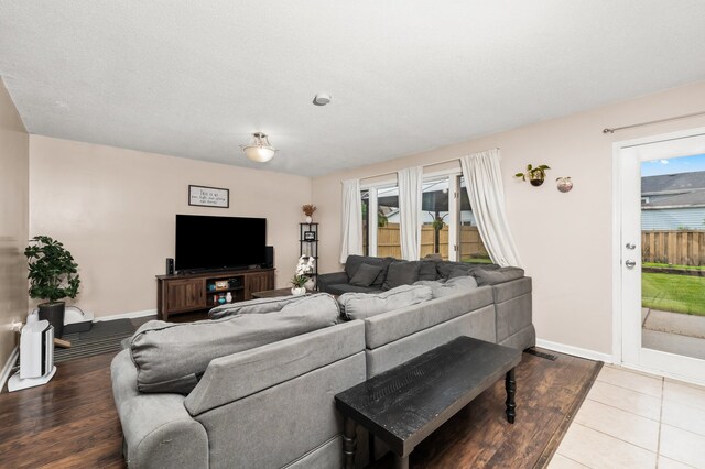 5401 W Arlington Dr, Hanover Park, IL 60133 - living room featuring plenty of natural light, baseboards, and wood finished floors