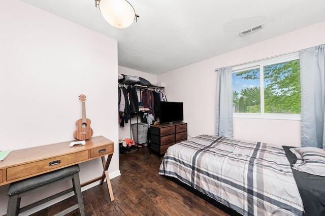5401 W Arlington Dr, Hanover Park, IL 60133 - bedroom featuring wood finished floors, a closet, and baseboards
