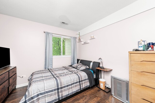 5401 W Arlington Dr, Hanover Park, IL 60133 - bedroom with dark wood-style flooring