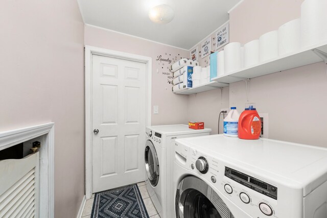 5401 W Arlington Dr, Hanover Park, IL 60133 - laundry area featuring washer and dryer, light tile patterned flooring, and baseboards