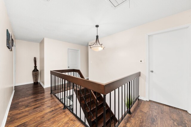 5401 W Arlington Dr, Hanover Park, IL 60133 - stairs with wood finished floors, attic access, and baseboards