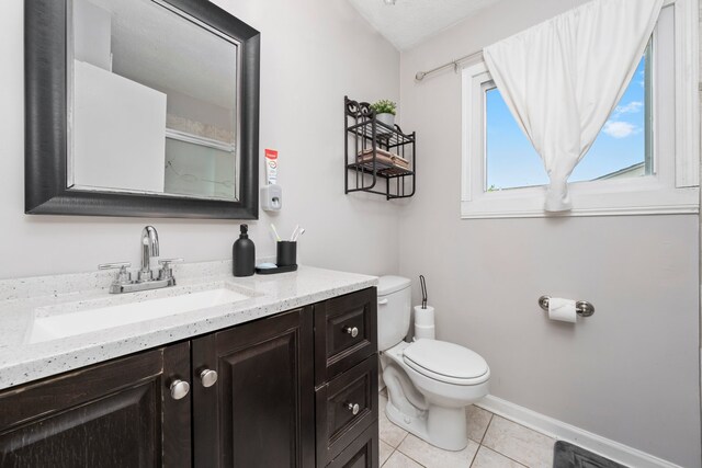 5401 W Arlington Dr, Hanover Park, IL 60133 - full bath featuring tile patterned flooring, toilet, vanity, and baseboards