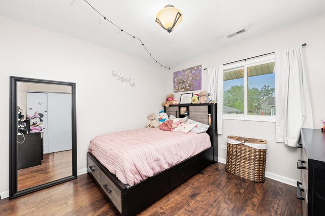 5401 W Arlington Dr, Hanover Park, IL 60133 - bedroom featuring wood finished floors and baseboards