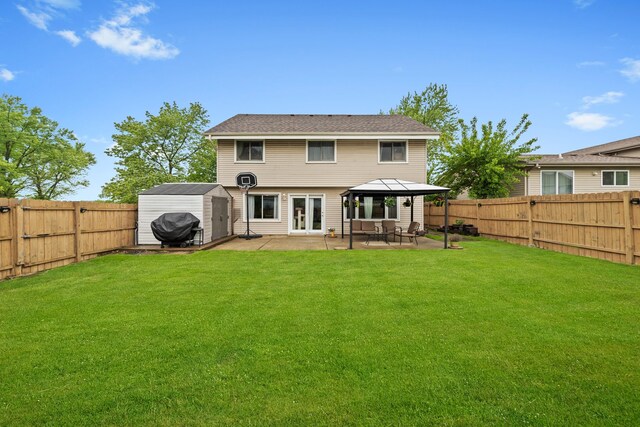 5401 W Arlington Dr, Hanover Park, IL 60133 - rear view of house with a patio and a gazebo