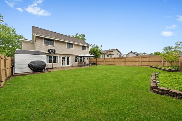 5401 W Arlington Dr, Hanover Park, IL 60133 - back of house with a patio area and a gazebo
