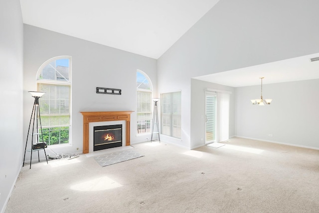 876 Dandridge Ct, Elgin, IL 60120 - unfurnished living room featuring high vaulted ceiling, carpet, a chandelier, and a fireplace with flush hearth