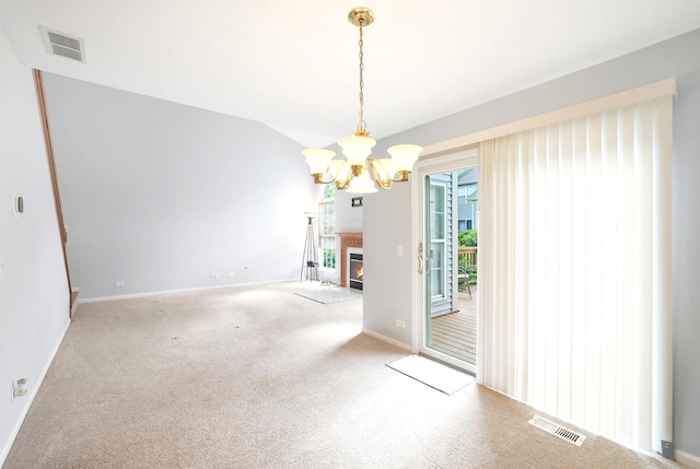 876 Dandridge Ct, Elgin, IL 60120 - unfurnished dining area with a chandelier, baseboards, carpet, a glass covered fireplace, and lofted ceiling