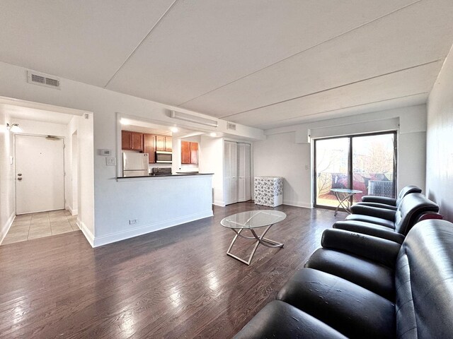 735 N Swift Rd Unit 102, Addison, IL 60101 - living area with wood finished floors and baseboards
