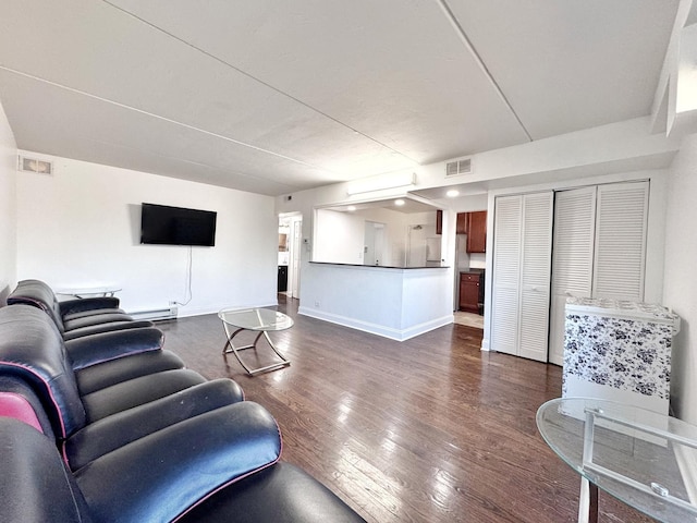 735 N Swift Rd Unit 102, Addison, IL 60101 - living area featuring dark wood-style flooring, baseboard heating, and baseboards