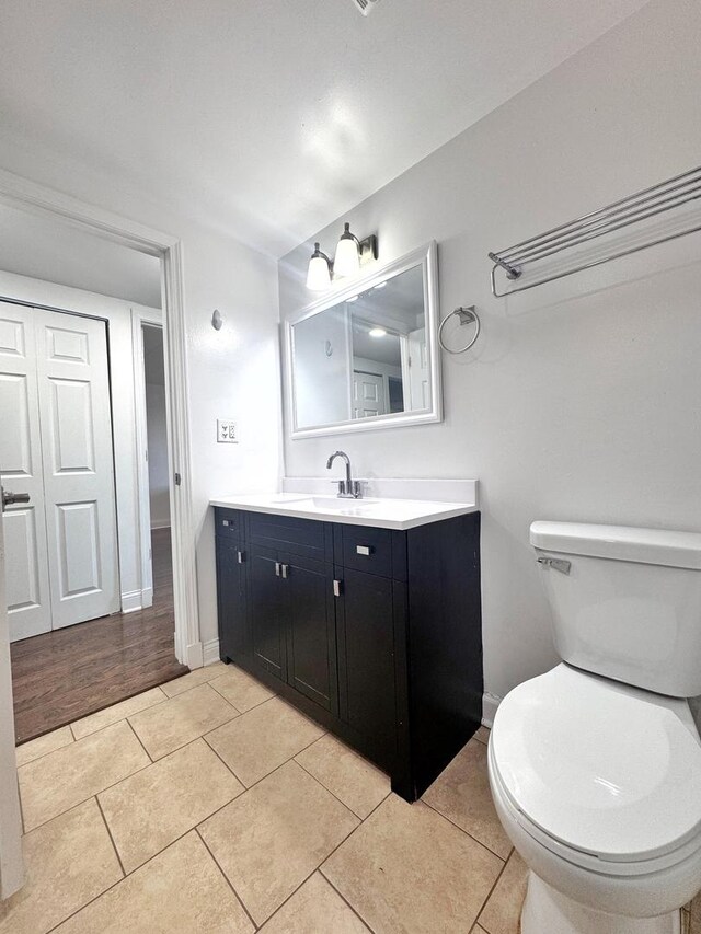 735 N Swift Rd Unit 102, Addison, IL 60101 - bathroom with toilet, tile patterned floors, vanity, and baseboards