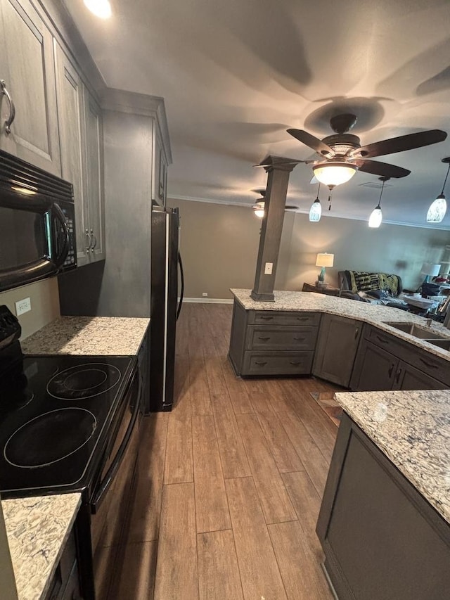 6525 Main St Unit 204, Downers Grove, IL 60516 - kitchen featuring black appliances, wood finished floors, a ceiling fan, light stone countertops, and ornamental molding