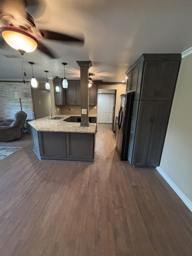 6525 Main St Unit 204, Downers Grove, IL 60516 - kitchen with ceiling fan, black refrigerator with ice dispenser, a peninsula, light stone countertops, and crown molding