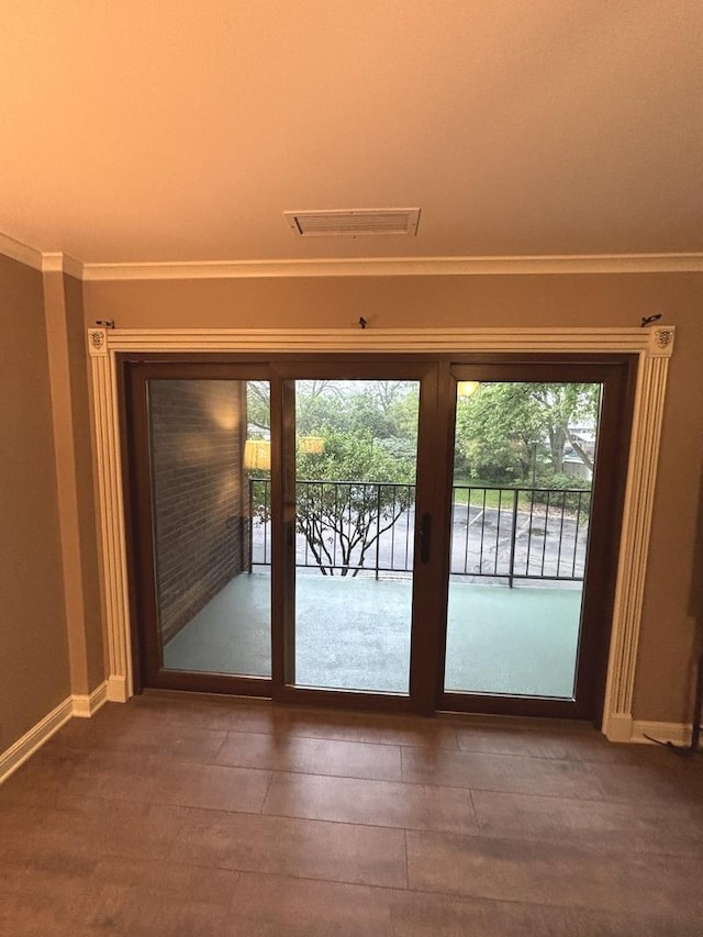 6525 Main St Unit 204, Downers Grove, IL 60516 - doorway to outside featuring baseboards and crown molding