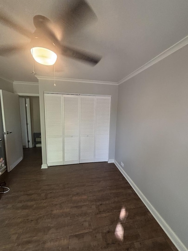 6525 Main St Unit 204, Downers Grove, IL 60516 - unfurnished bedroom featuring crown molding, a closet, dark wood-style floors, and a ceiling fan