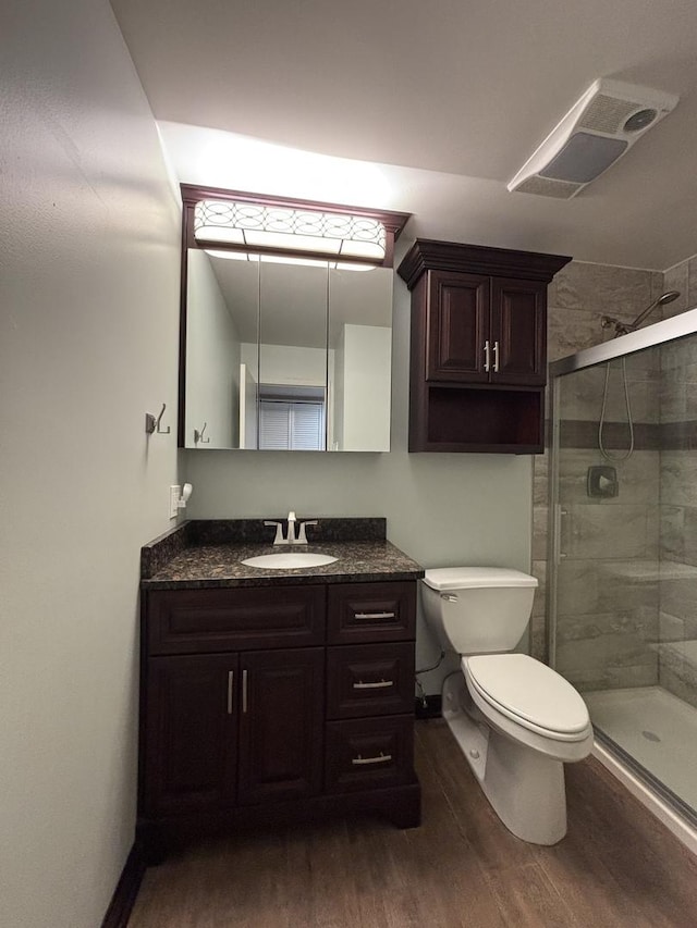 6525 Main St Unit 204, Downers Grove, IL 60516 - full bathroom with wood finished floors, vanity, and a stall shower