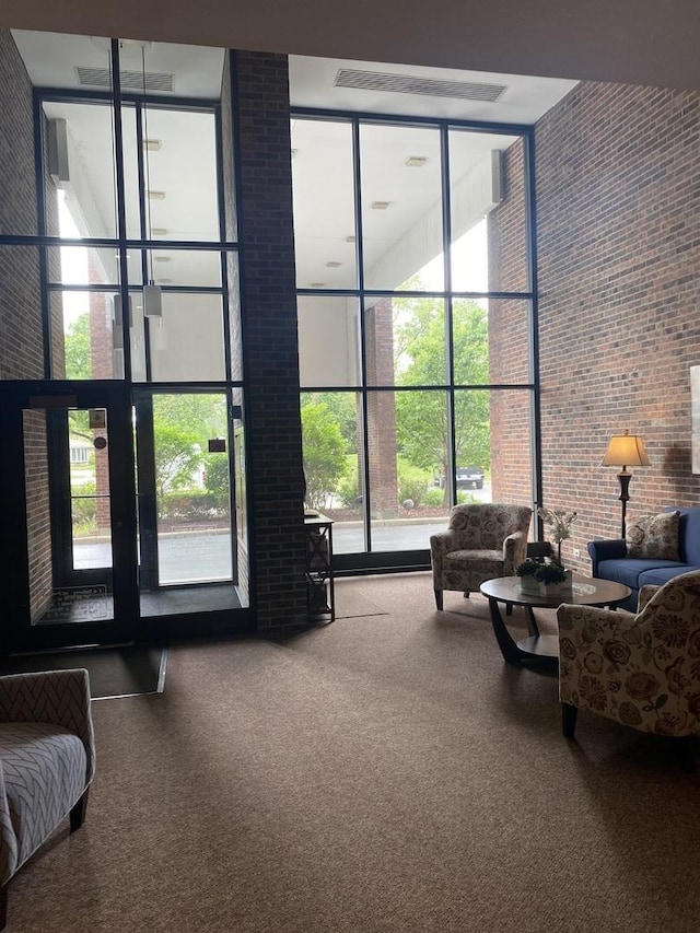 6525 Main St Unit 204, Downers Grove, IL 60516 - building lobby with a towering ceiling, expansive windows, and brick wall
