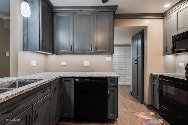 6525 Main St Unit 204, Downers Grove, IL 60516 - kitchen featuring black appliances, light wood finished floors, light stone counters, and pendant lighting