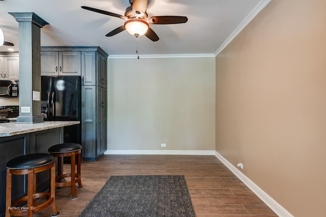 6525 Main St Unit 204, Downers Grove, IL 60516 - kitchen with black appliances, a ceiling fan, dark wood finished floors, crown molding, and a kitchen breakfast bar