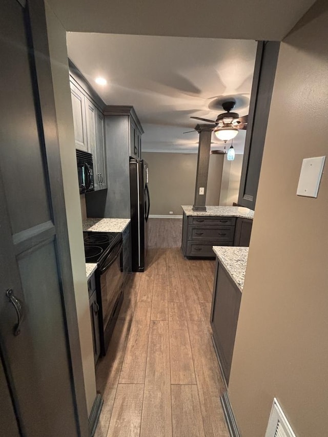 6525 Main St Unit 204, Downers Grove, IL 60516 - kitchen featuring black appliances, light wood-type flooring, ceiling fan, light stone counters, and gray cabinetry