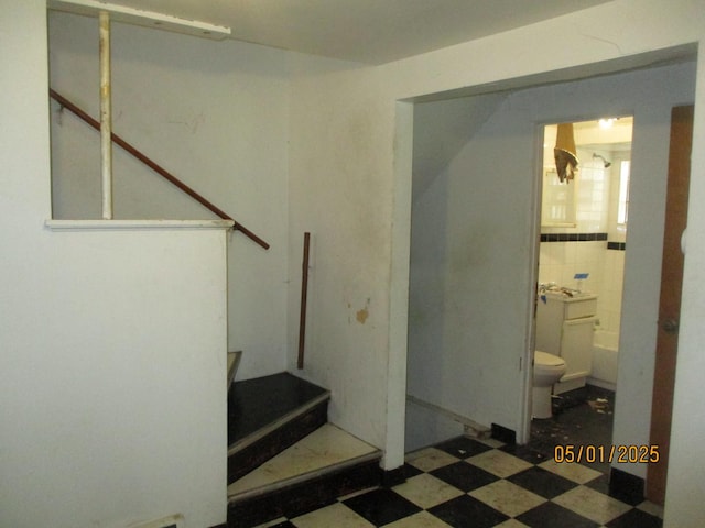 stairs with tile patterned floors