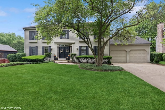 1965 Jamestown Ln, Elgin, IL 60123 - view of front of house featuring concrete driveway, a front yard, and a garage