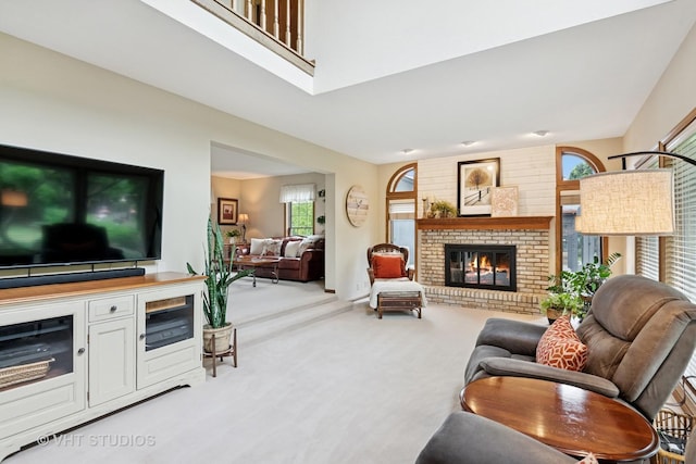 1965 Jamestown Ln, Elgin, IL 60123 - carpeted living area featuring a brick fireplace and healthy amount of natural light