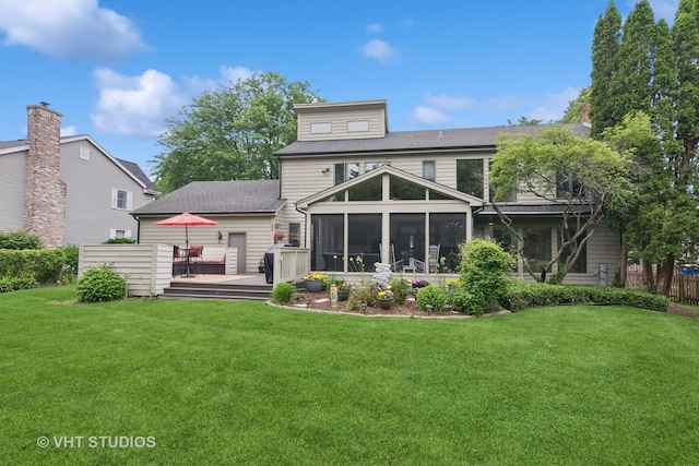 1965 Jamestown Ln, Elgin, IL 60123 - back of property with a sunroom, a wooden deck, and a shingled roof