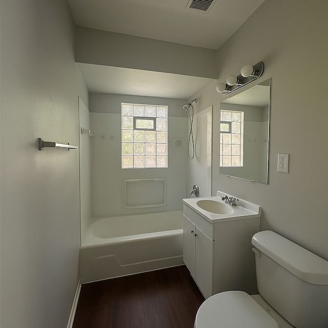 11709 S Kedzie Ave, Merrionette Park, IL 60803 - bathroom featuring toilet, shower / bathtub combination, vanity, and wood finished floors