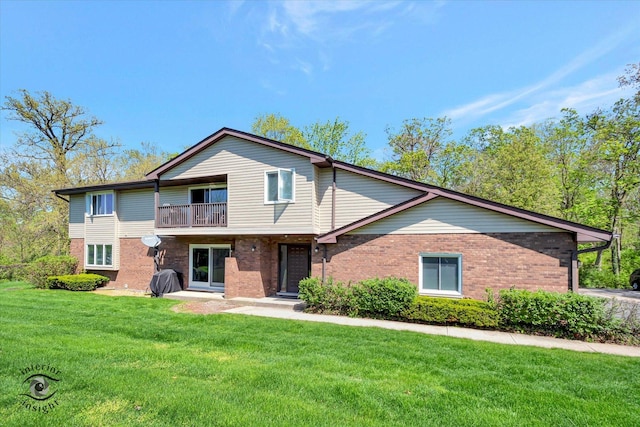 409 Manor Ct Unit A, New Lenox, IL 60451 - multi unit property featuring a balcony, brick siding, and a front yard