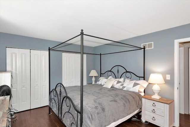 409 Manor Ct Unit A, New Lenox, IL 60451 - bedroom featuring dark wood finished floors and two closets