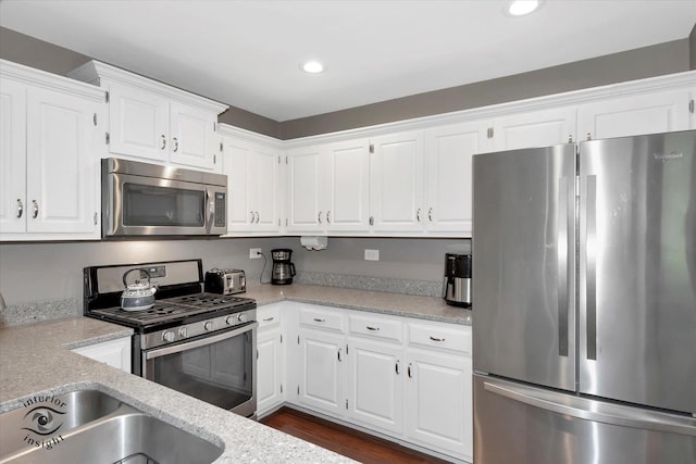 409 Manor Ct Unit A, New Lenox, IL 60451 - kitchen featuring appliances with stainless steel finishes, white cabinets, a sink, recessed lighting, and dark wood finished floors