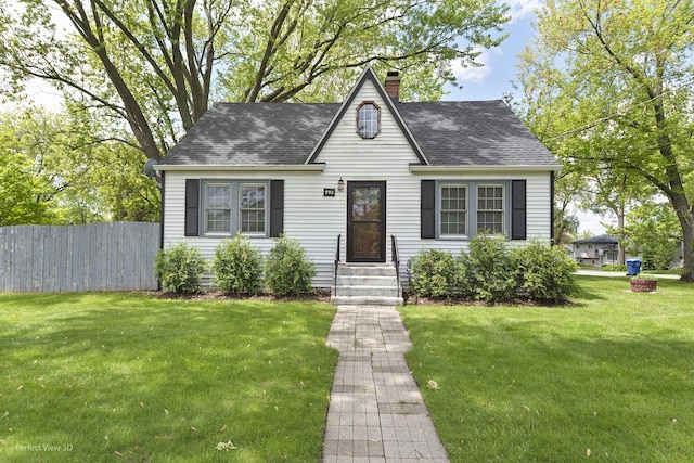 990 Magnolia Ave, Gurnee, IL 60031 - view of front of house with a chimney, a shingled roof, and entry steps