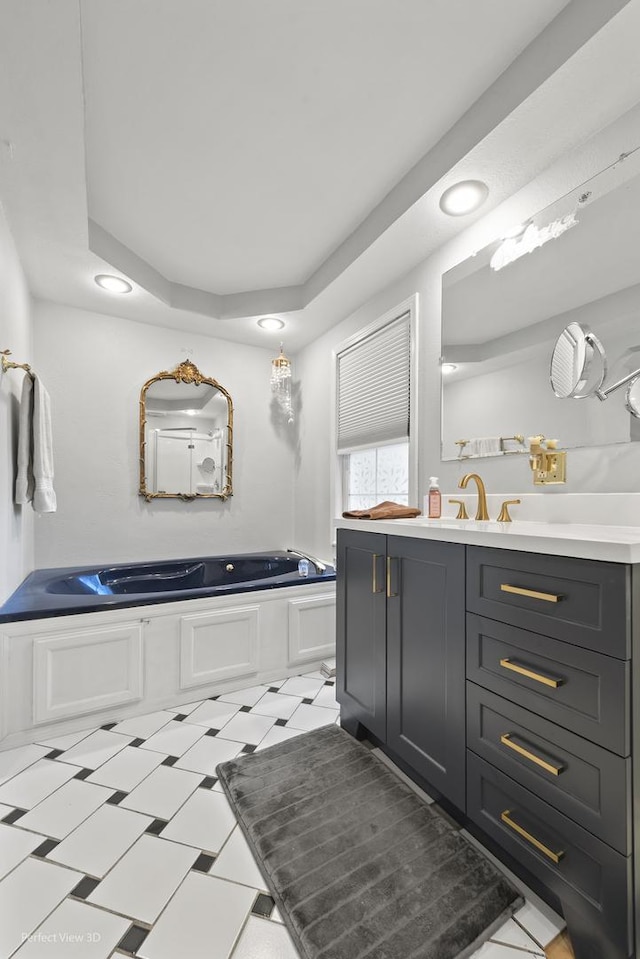 990 Magnolia Ave, Gurnee, IL 60031 - bathroom with vanity, a garden tub, recessed lighting, and a raised ceiling