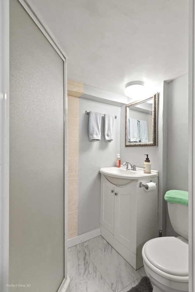 990 Magnolia Ave, Gurnee, IL 60031 - bathroom with vanity, a shower stall, toilet, marble finish floors, and baseboards
