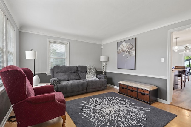 990 Magnolia Ave, Gurnee, IL 60031 - living area with wood finished floors, crown molding, and baseboards