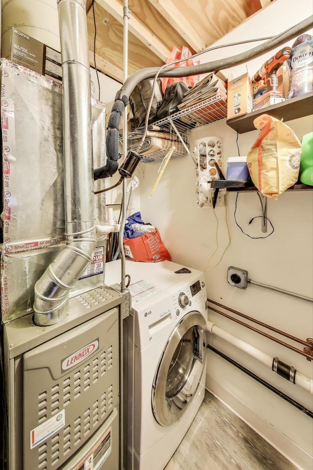 525 N Halsted St Unit 409, Chicago, IL 60642 - washroom with washer / clothes dryer and wood finished floors