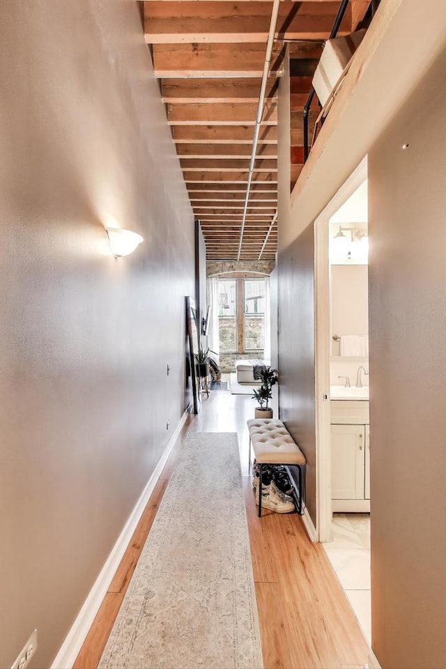 525 N Halsted St Unit 409, Chicago, IL 60642 - corridor with light wood-style floors, baseboards, and beamed ceiling